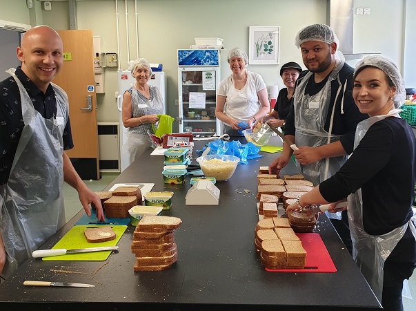 Volunteers make sandwiches in Clifton