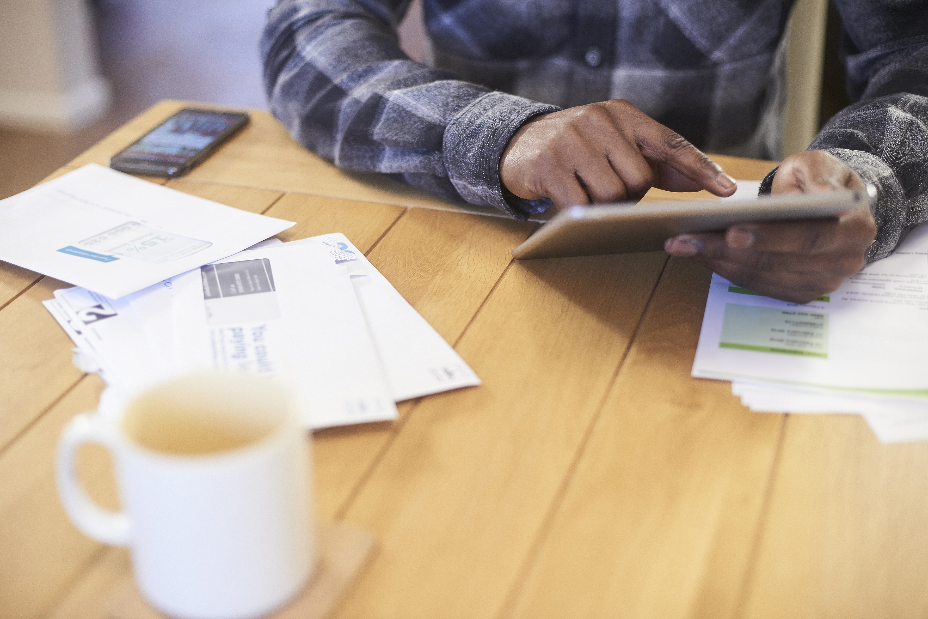 Person using tablet to search for a better deal