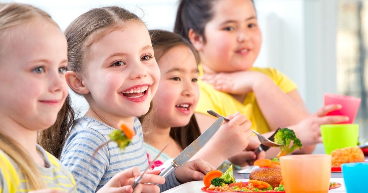Children enjoying school dinners