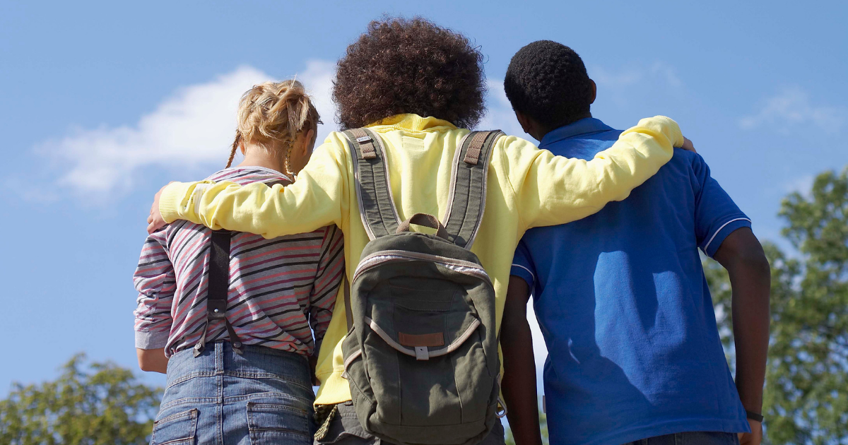 Three teenagers walking together