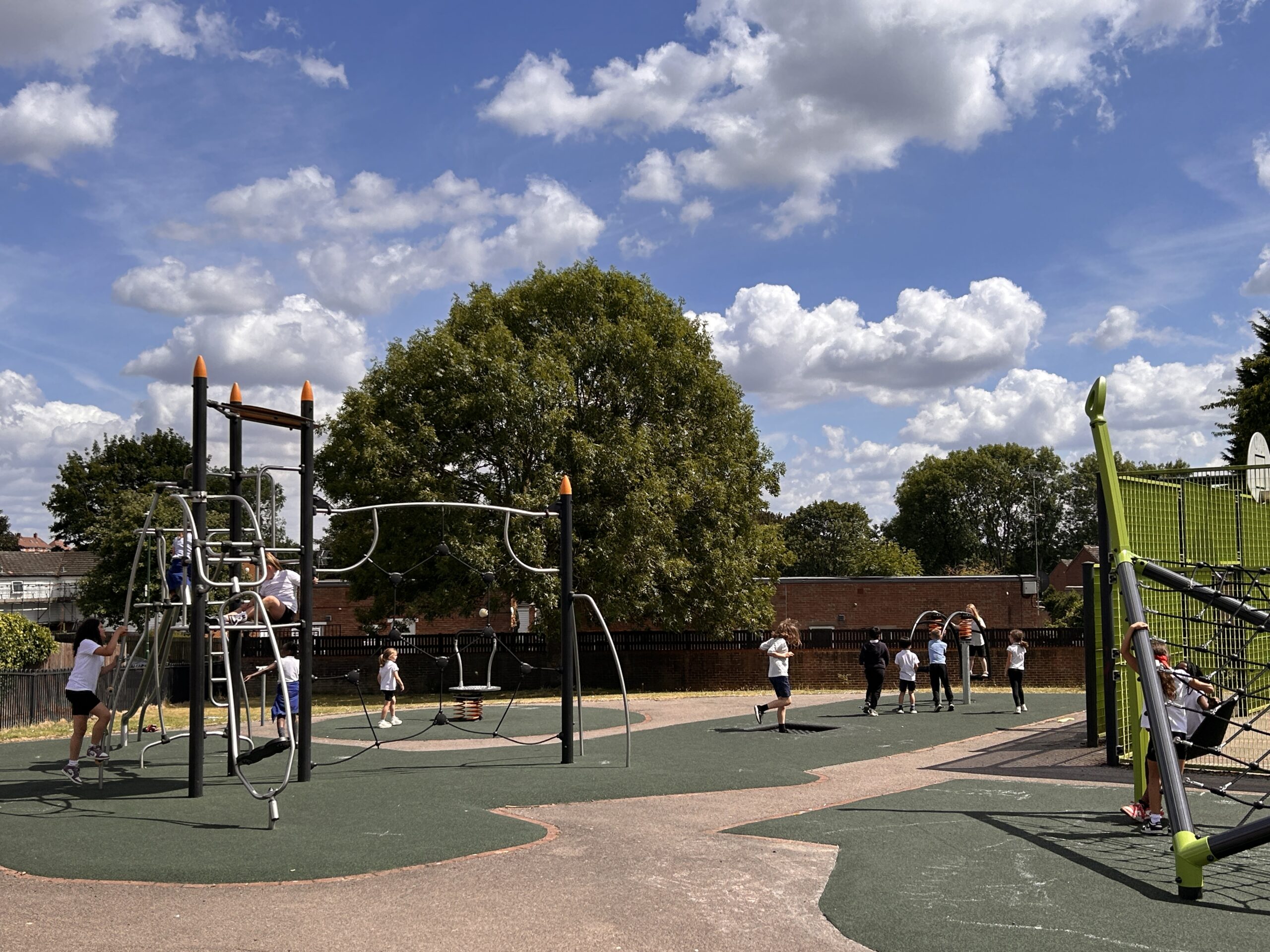 Children playing in a park play area